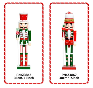 Detail view of two 38cm wooden nutcracker soldiers with candy-themed Christmas decorations