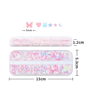12-grid box of pink iridescent nail art sequins with butterfly and heart shapes
