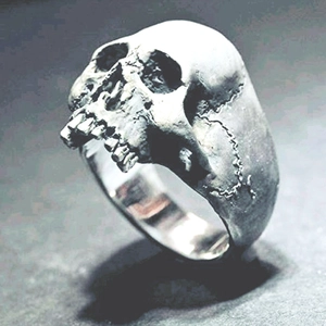 Vintage gothic skull ring for men with oxidized silver finish and punk style details