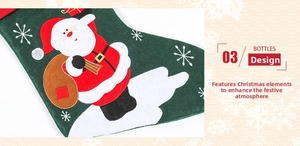 Detail of green linen Christmas stocking featuring Santa Claus embroidery and snowflakes