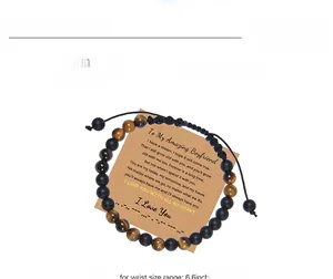 Detail of Morse code beaded bracelet with tiger eye stones on a sentimental gift card