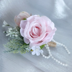 Handmade silk pink rose wedding boutonniere with green leaves and pearl twine stem