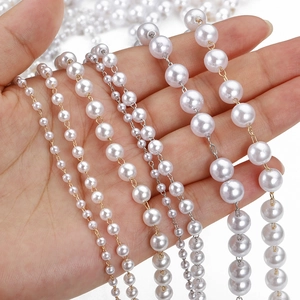 Various sizes of white faux pearl chains with gold and silver metal for DIY jewelry making