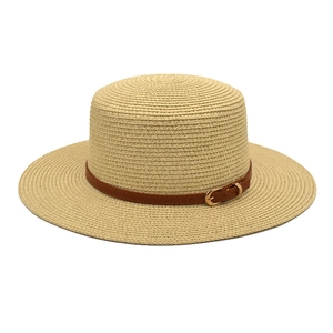 Elegant beige straw boater hat with a dark brown leather band and gold buckle detail