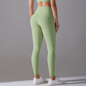 Rear view of high-waist avocado green yoga leggings showing bum lift design details