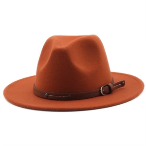 Detailed close-up of felt fedora hat featuring a brown leather band with metal buckle