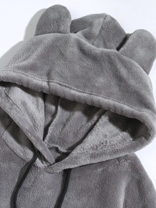 Detail of grey hoodie showing soft coral fleece texture and cute bear ear hood design