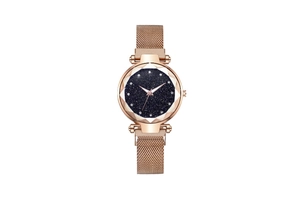 Detail of rose gold Milanese strap watch with faceted crystal and blue starry sky dial