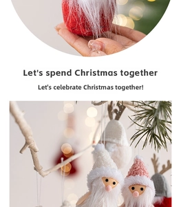 Detail of plush Christmas gnome ornaments hanging on white branches with festive bokeh