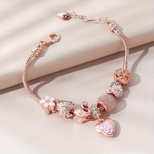 Bracelet à perles en or rose avec cygne rose, breloques cœur et pendentifs roses