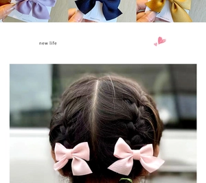 Detail showing various colors of satin bow hair clips for girls on display cards