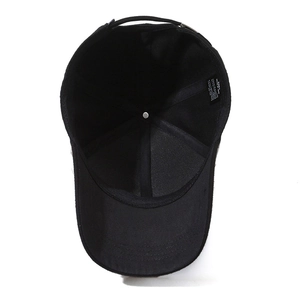 Interior view of a classic black baseball cap showing the quality and wash tag