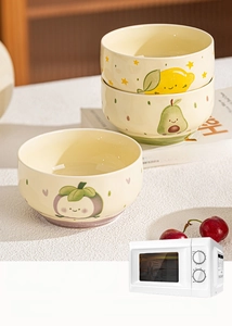 Detail showing ceramic fruit bowl trio with microwave and dishwasher safe labels