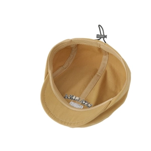 Adjustable khaki cotton newsboy cap with internal sweatband and elastic drawstring
