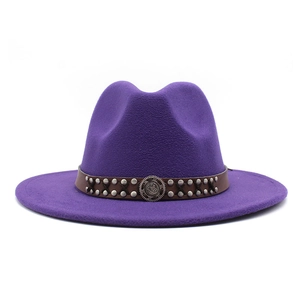 Detailed macro view of deep purple wool fedora hat with studded brown leather band