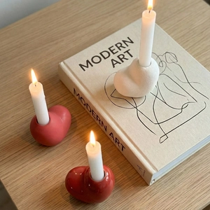 Minimalist heart-shaped ceramic candle holder set in red and white for home decor