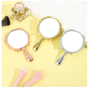 Rose-shaped handheld makeup mirrors in rose gold, gold, and silver metallic finishes