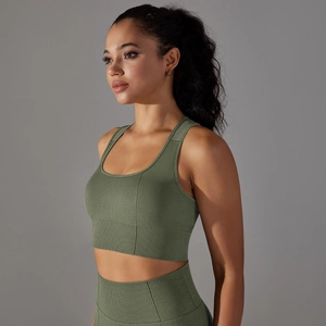 Detail of avocado green seamless knitted sports bra showing breathable texture and racerback