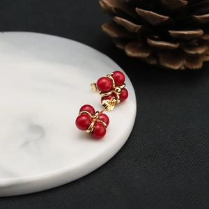 Elegant 18k gold plated red pearl stud earrings with classic four-prong setting