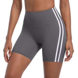 Close-up of high-waist grey yoga shorts with white stripes and elastic fabric detail
