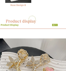 Close-up of golden rose hair claw clip with sparkling rhinestones and pearl details