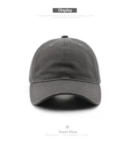Front view of charcoal grey washed cotton baseball cap with curved brim and ventilation eyelets