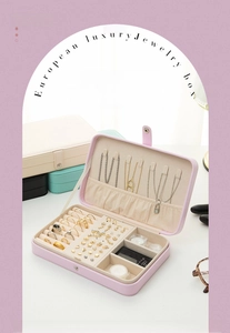 Detail view of macaron colored PU leather jewelry boxes with organized compartments