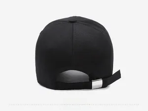Detail of black cotton baseball cap back with adjustable strap and silver metal buckle