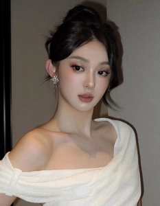 Close-up of sparkling star-shaped earrings on a model for a minimalist fashion look