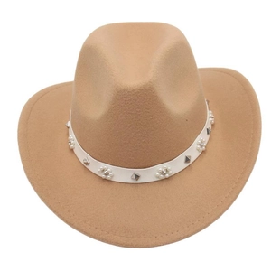 Detailed view of a tan wool felt cowboy hat featuring a white band with pearls and studs.