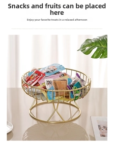 Close-up of golden metal mesh fruit basket showing intricate round wire texture and base