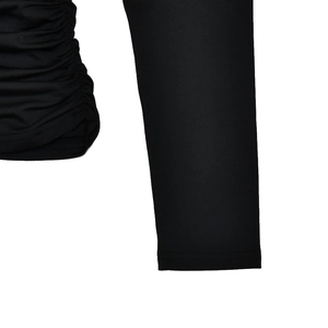 Detailed close-up of textured knitted fabric and ruched cuff on this black open back T-shirt