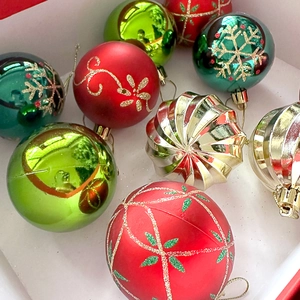 Close-up of assorted colorful 6cm Christmas balls with snowflake and glitter patterns