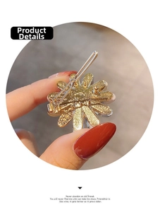 Close-up of the golden alloy hair clip back showing the durable spring bar mechanism