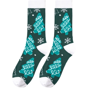 Detailed view of green Christmas socks with white tree and snowflake knit patterns