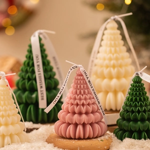 Origami Christmas tree scented candles in green, pink and cream with festive ribbons