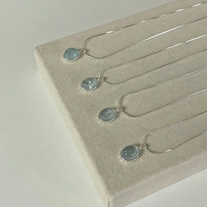 Natural aquamarine moonstone necklaces with oval pendants on silver snake chains
