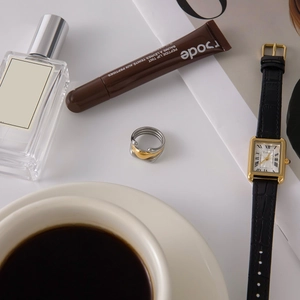 Close-up of a layered gold and silver mixed-metal ring in a luxury lifestyle setting
