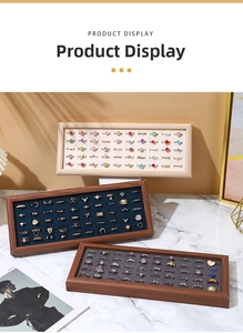 Detailed view of rectangular walnut jewelry trays with plush velvet slots for rings