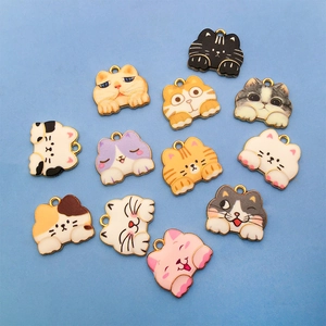 Detailed overhead view of colorful 18x16mm cat enamel charms for DIY jewelry making