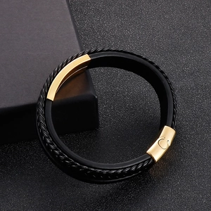 Close-up of triple-layer braided leather bracelet with golden stainless steel buckle