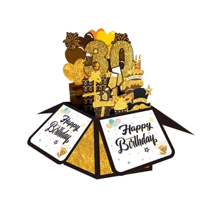 3D pop-up 30th birthday card in black and gold featuring gift boxes and balloons