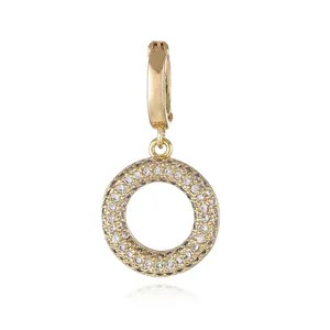 Detailed close-up of 18k gold plated micro-pave zircon round pendant clasp for jewelry