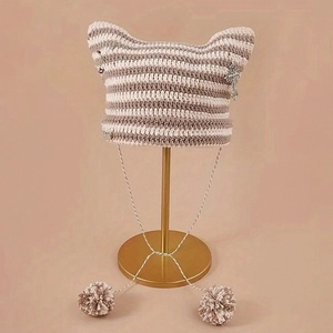 Striped knit cat ear beanie with pom-poms and punk cross charm in beige and brown