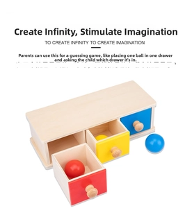 Detail view of Montessori wooden 3-color drawer box with red, yellow and blue balls