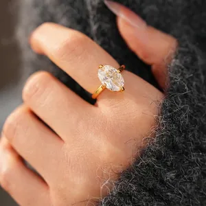 18k gold plated oval zircon ring with minimalist open design worn on a finger