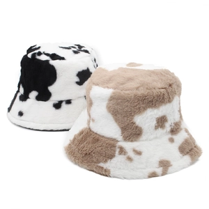 Winter plush bucket hats with faux fur cow print in black and brown patterns