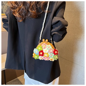 Handcrafted crochet flower shell bag with wooden frame and pearl shoulder strap detail