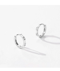 Macro shot of S925 sterling silver earring hoop showing the metal authenticity hallmark