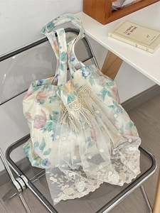 Linen tote bag with floral prints, white lace layers, and delicate flower embroidery